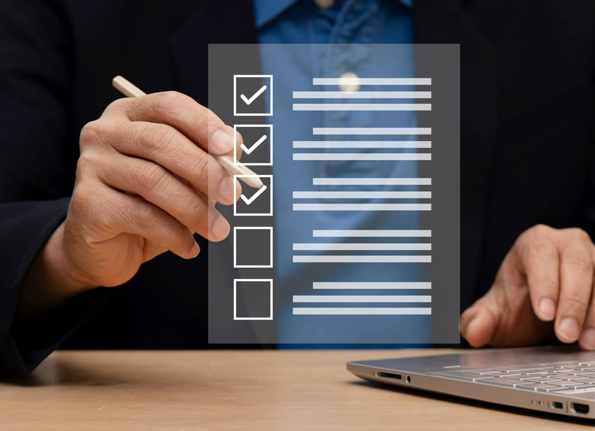 checklist overlayed over person holding pen